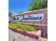 Decorative community entrance sign surrounded by colorful flowers, creating a welcoming atmosphere at 1869 E Birch St, Casa Grande, AZ 85122
