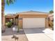 Charming single-story home with a two-car garage, desert landscaping, and a welcoming entrance at 1869 E Birch St, Casa Grande, AZ 85122