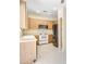 Well-lit kitchen features light wood cabinetry and stainless steel appliances at 1869 E Birch St, Casa Grande, AZ 85122