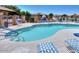Community pool with lounge seating and a tranquil waterfall feature, perfect for relaxation at 1869 E Birch St, Casa Grande, AZ 85122
