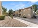 Exterior view of the multi-story apartment buildings, showcasing the community's architecture and landscaping at 1880 E Morten Ave # 124, Phoenix, AZ 85020