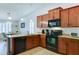 Functional kitchen featuring granite countertops, modern appliances, and a breakfast bar with pendant lighting at 2101 S Meridian Rd # 190, Apache Junction, AZ 85120