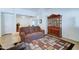 Living room with neutral walls, tile floors, stylish furnishings, a decorative rug, and a hutch at 2101 S Meridian Rd # 190, Apache Junction, AZ 85120