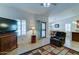 Inviting living room featuring neutral walls, tile floors, a ceiling fan, and sliding glass doors leading to the patio at 2101 S Meridian Rd # 190, Apache Junction, AZ 85120