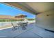 Relaxing covered patio with dining table set, offering a cool outdoor space for meals at 2101 S Meridian Rd # 190, Apache Junction, AZ 85120