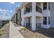 Modern townhome featuring a private balcony and landscaped front yard, perfect for outdoor enjoyment at 2121 W Sonoran Desert Dr # 93, Phoenix, AZ 85085