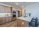 Modern kitchen featuring white countertops, stainless steel appliances and sleek breakfast bar seating at 2121 W Sonoran Desert Dr # 93, Phoenix, AZ 85085