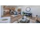 Open-concept living space with kitchen view, dining area, and modern decor elements at 2121 W Sonoran Desert Dr # 93, Phoenix, AZ 85085