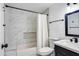 Stylish bathroom with a tiled shower and tub, and a modern vanity with updated fixtures at 2217 E Sheridan St, Phoenix, AZ 85006