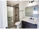 Modern bathroom with a walk-in shower, tile accents, a sleek mirror, and a stylish vanity at 2217 E Sheridan St, Phoenix, AZ 85006