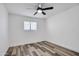 Clean bedroom featuring a ceiling fan, window and hard flooring at 2217 E Sheridan St, Phoenix, AZ 85006