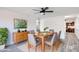 Modern dining room features natural light, wood table, stylish chairs and tasteful decor at 2217 E Sheridan St, Phoenix, AZ 85006