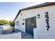 Elegant front entrance with stylish double doors, decorative glass, and modern lighting fixtures at 2217 E Sheridan St, Phoenix, AZ 85006