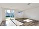 Bright, open living room with sliding glass doors leading to the backyard and modern wood-look flooring at 2217 E Sheridan St, Phoenix, AZ 85006