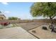 Spacious backyard with sand pit, seating and room for outdoor activities at 25622 N Singbush Loop, Phoenix, AZ 85083