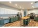 Spacious kitchen with a butcher block island, stainless steel appliances, and modern, colorful cabinetry at 25622 N Singbush Loop, Phoenix, AZ 85083