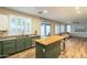 Kitchen featuring an island, stainless steel dishwasher, farmhouse sink, and lots of natural light at 25622 N Singbush Loop, Phoenix, AZ 85083