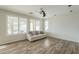 Inviting living room features wood floors, and lots of natural light at 25622 N Singbush Loop, Phoenix, AZ 85083