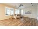 Bright living room with many windows, fan and comfortable seating at 25622 N Singbush Loop, Phoenix, AZ 85083