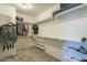 Walk-in closet features carpeted floor, ample hanging racks, and built-in shelving at 25622 N Singbush Loop, Phoenix, AZ 85083