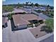 Aerial view showcasing the home's layout, landscaping, and location in a quiet neighborhood at 2605 E Geneva Dr, Tempe, AZ 85282