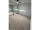 Bedroom featuring a window with blinds and mirrored closet at 2605 E Geneva Dr, Tempe, AZ 85282