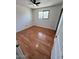 Bedroom featuring wainscotting, a window and a ceiling fan at 2605 E Geneva Dr, Tempe, AZ 85282