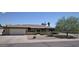 Traditional single-story home with a brick facade, two-car garage and mature landscaping at 2605 E Geneva Dr, Tempe, AZ 85282