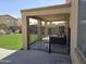 View of covered back patio with fenced in area and artificial turf at 28273 N Castle Rock Dr, San Tan Valley, AZ 85143