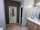 Bathroom entryway with tile flooring, and an open view into the walk-in closet and into a separate toilet room at 28273 N Castle Rock Dr, San Tan Valley, AZ 85143