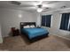 View of a bedroom with carpet flooring, neutral paint, a king bed, ceiling fan and curtains at 28273 N Castle Rock Dr, San Tan Valley, AZ 85143