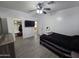 Cozy bedroom with closet, ceiling fan, and view of bathroom at 28273 N Castle Rock Dr, San Tan Valley, AZ 85143