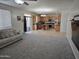 View of the living room leading into the kitchen, showcasing a large open-concept space at 28273 N Castle Rock Dr, San Tan Valley, AZ 85143