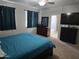 View of the main bedroom with a ceiling fan, carpeted floors, curtains, a king bed, and ensuite bathroom at 28273 N Castle Rock Dr, San Tan Valley, AZ 85143