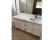 Bathroom featuring white cabinets, chrome hardware, and tiled floors at 2875 W Muriel Dr, Phoenix, AZ 85053