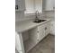 Modern kitchen featuring a stainless steel sink, tile floor and white cabinets at 2875 W Muriel Dr, Phoenix, AZ 85053