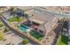 Aerial view of a backyard featuring a sparkling pool, covered patio, and mature landscaping at 2928 E Palm St, Mesa, AZ 85213