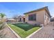 Landscaped backyard with putting green and pool view at 2928 E Palm St, Mesa, AZ 85213