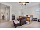 Inviting bedroom with wooden sleigh bed and cozy armchair at 2928 E Palm St, Mesa, AZ 85213