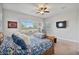 Bright bedroom with ceiling fan, large window and floral bedding at 2928 E Palm St, Mesa, AZ 85213