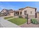 Attractive home featuring stone accents, a well-kept lawn, and desert landscaping for a striking curb appeal at 2928 E Palm St, Mesa, AZ 85213