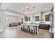 Open kitchen with an island featuring seating, pendant lights, and a seamless connection to the dining area at 2928 E Palm St, Mesa, AZ 85213