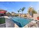 Inviting pool with cool, sparkling water and landscaped surroundings, perfect for relaxation and recreation at 2928 E Palm St, Mesa, AZ 85213