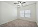 Bedroom with natural light, neutral paint, carpet flooring and a ceiling fan at 33575 N Dove Lakes Dr # 2028, Cave Creek, AZ 85331