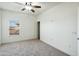 Bright bedroom with plush carpet, ceiling fan, and a window providing natural light at 33575 N Dove Lakes Dr # 2028, Cave Creek, AZ 85331