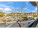 Scenic balcony view overlooking a community pool with lush landscaping and surrounding buildings at 33575 N Dove Lakes Dr # 2028, Cave Creek, AZ 85331