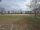 Community basketball court features multiple hoops, landscaping, and trees for residents at 3408 S 184Th Ln, Goodyear, AZ 85338