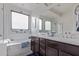 Bright bathroom with a soaking tub, double vanity, and natural light at 3408 S 184Th Ln, Goodyear, AZ 85338