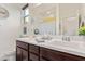 Bright bathroom featuring double sinks, a large mirror, and modern fixtures at 3408 S 184Th Ln, Goodyear, AZ 85338