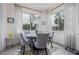 Elegant dining room with natural light, chandelier, stylish rug, and seating for six at 3408 S 184Th Ln, Goodyear, AZ 85338